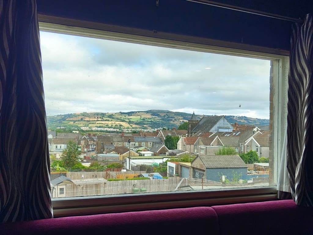 The view from the function room window over the rooftops of Caerphilly towards the mountain